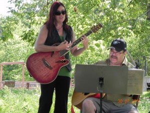 Sue anf Morley play and sing at PurdyFest